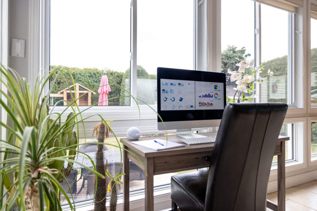 home office in a conservatory with a solid tiled and insulated roof