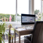 home office in a conservatory with a solid tiled and insulated roof